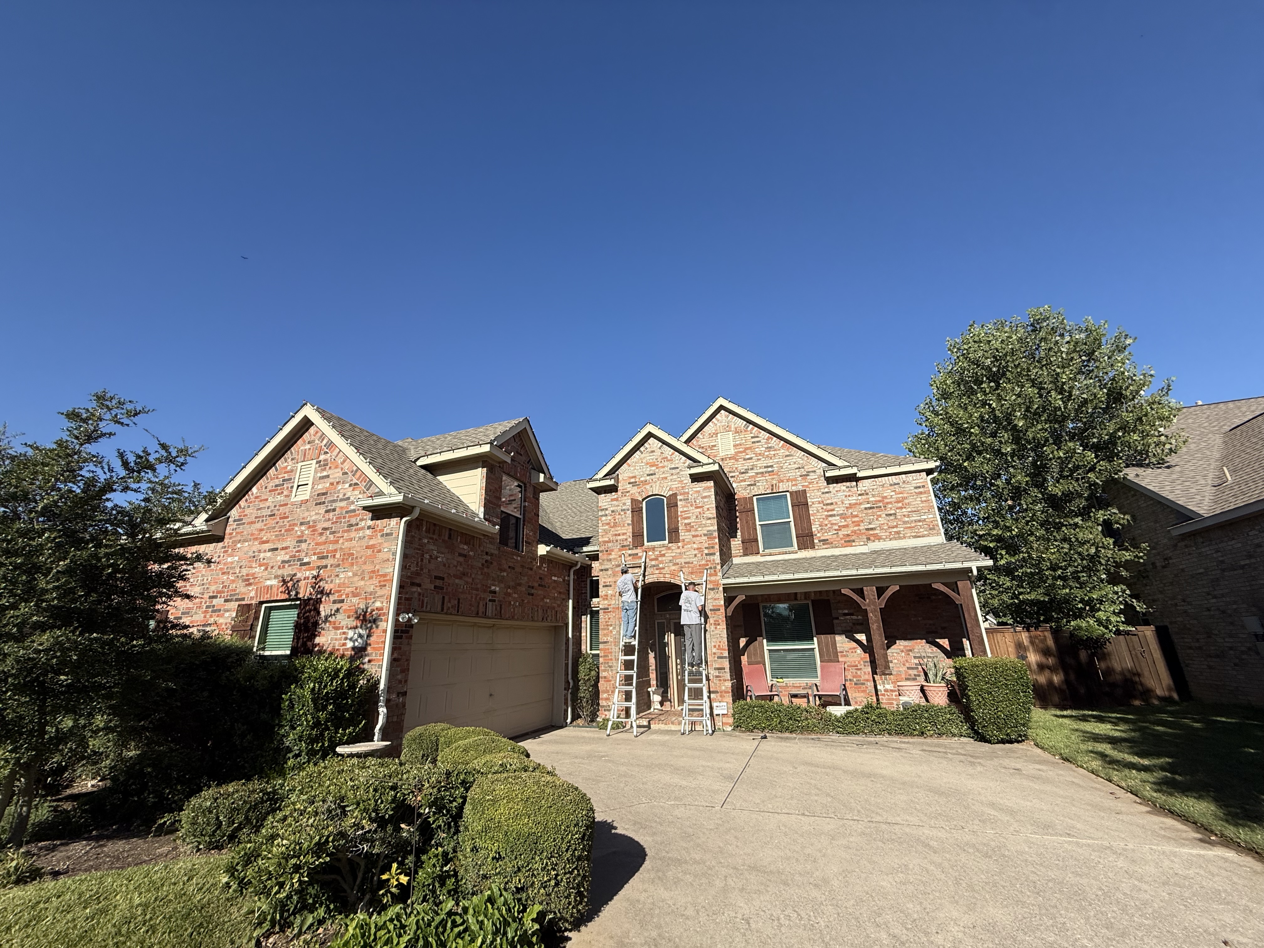 Large two-story home prepared for holiday lighting installation